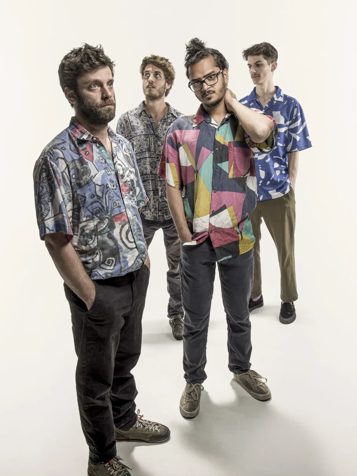 Ravi Ramsahye PROTOTYPE quartet posing together in colourful patterned shirts for a studio press photo, Suisse Diagonales Jazz 2024